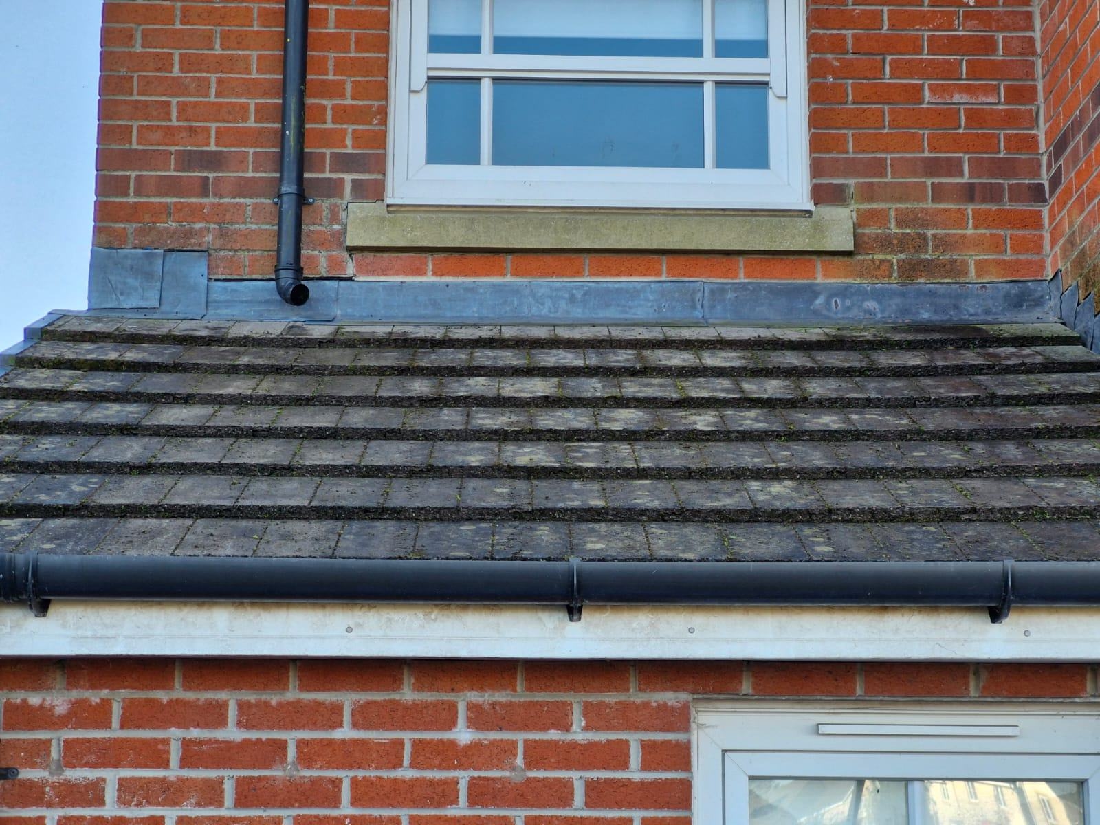 Removing moss from a tiled entrance roof - Frosty Enterprises Ltd t/a Frostys Cleaning Services