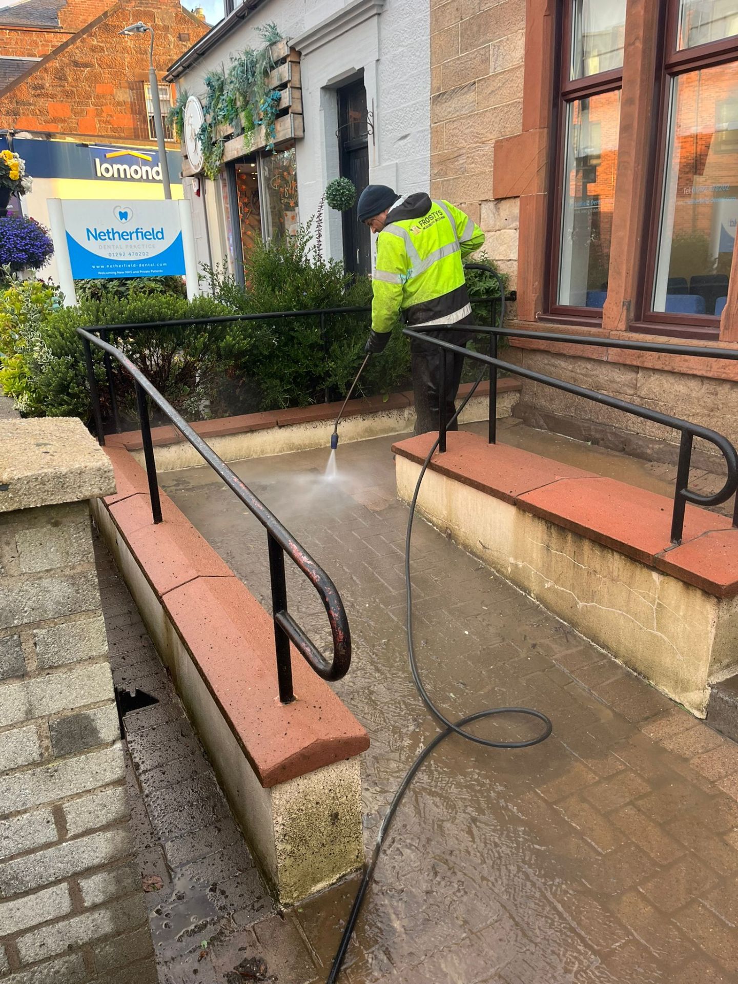 Pressure washing a paved entrance ramp - Frosty Enterprises Ltd t/a Frostys Cleaning Services