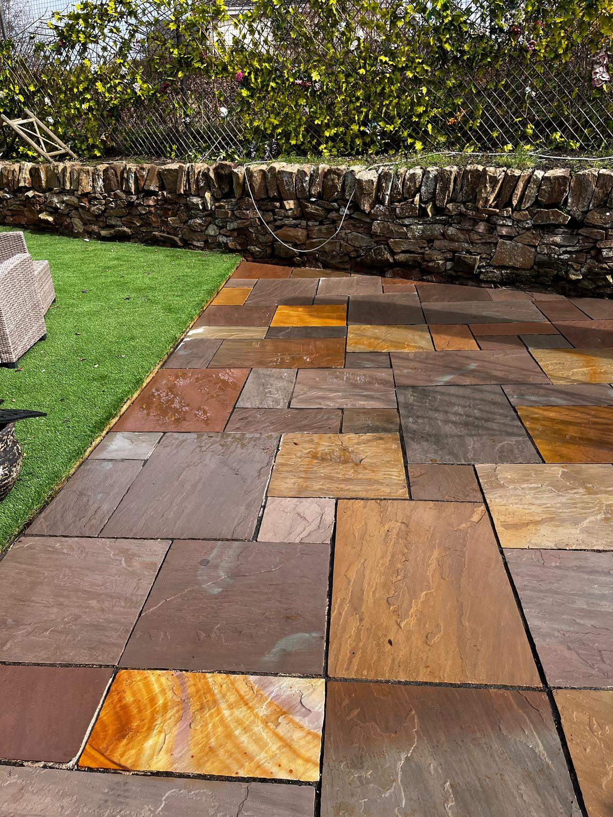 Softwashing paving beside a garden wall - Frosty Enterprises Ltd t/a Frostys Cleaning Services