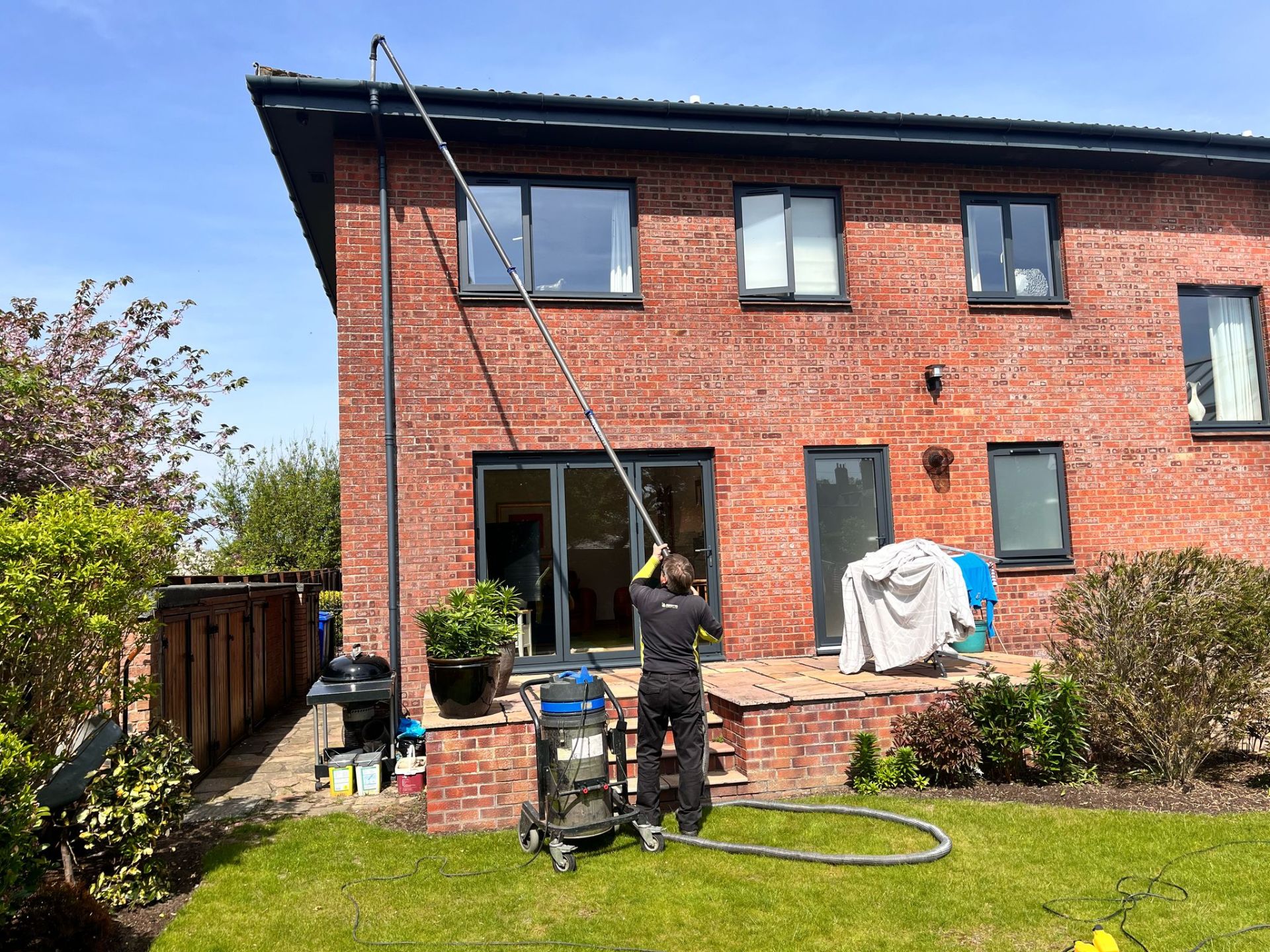 Clearing house gutters with a vacuum system - Frosty Enterprises Ltd t/a Frostys Cleaning Services