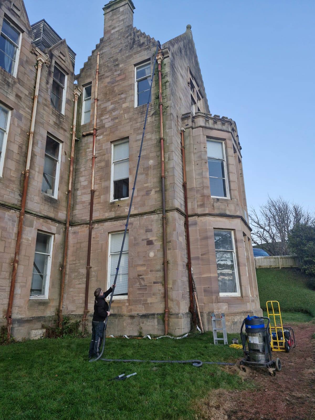 High-level gutter clearing on a stone building - Frosty Enterprises Ltd t/a Frostys Cleaning Services